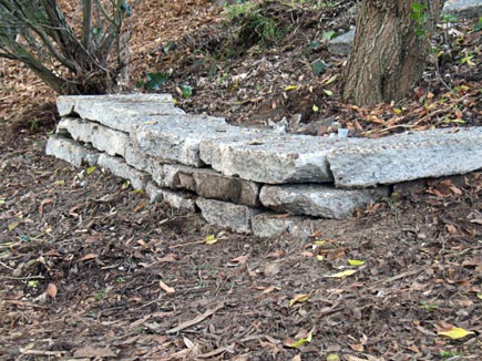 retaining wall made from slabs of broken-up concrete